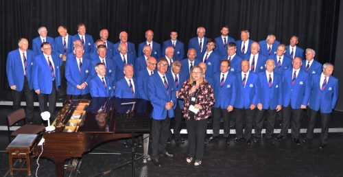 Helen Morris representing the Welsh Air Ambulance Service receiving a cheque in the sum £1,000 from Jim Evans, President of Builth Male Voice Choir.