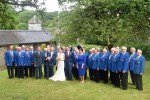 Bleddfa wedding – couple with choir in orchard&nbsp;(2)